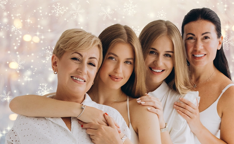 Four women on a holiday background.